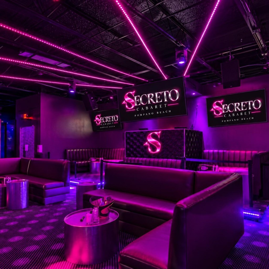 Magenta lounge with leather banquettes and Secreto screens